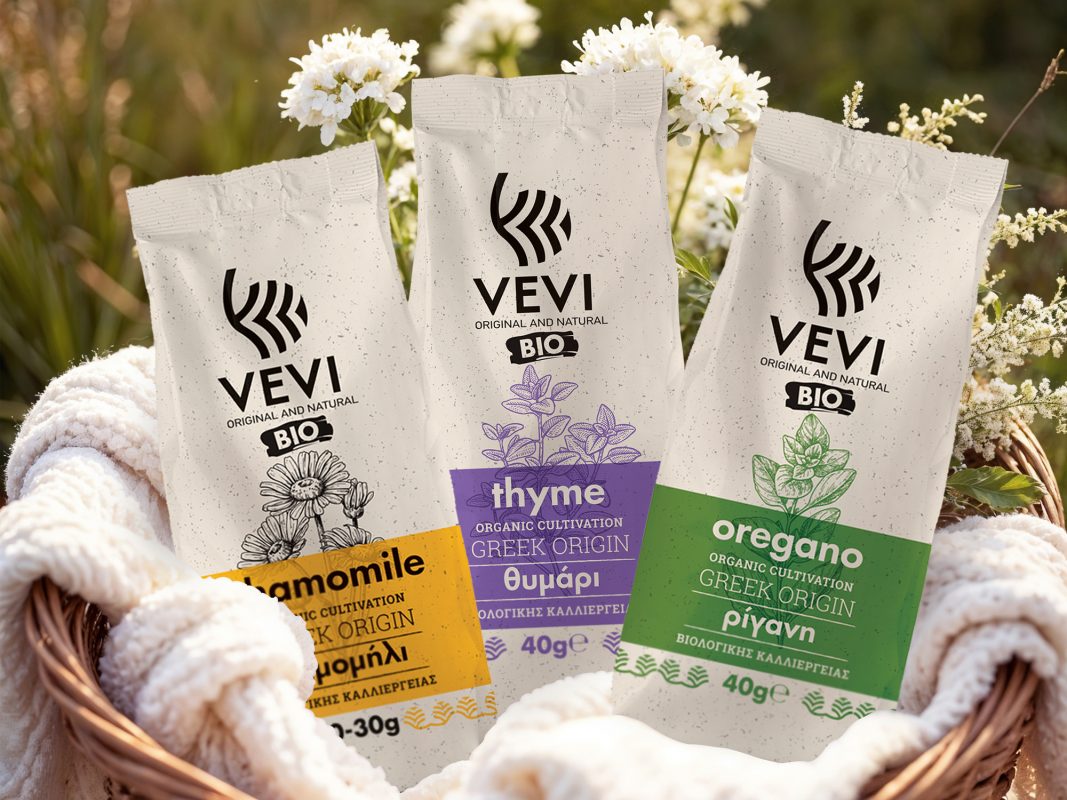 Basket of VEVI organic herb sachets in a Greek field